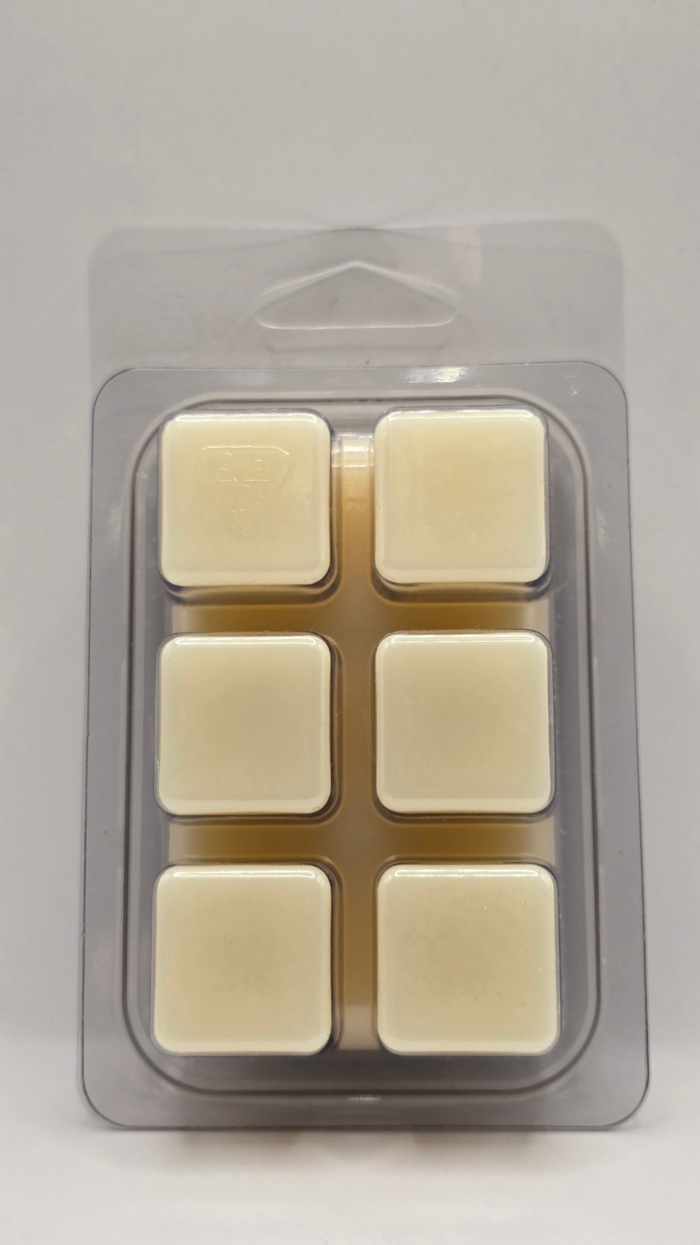 Packaged wax melts on a gray background