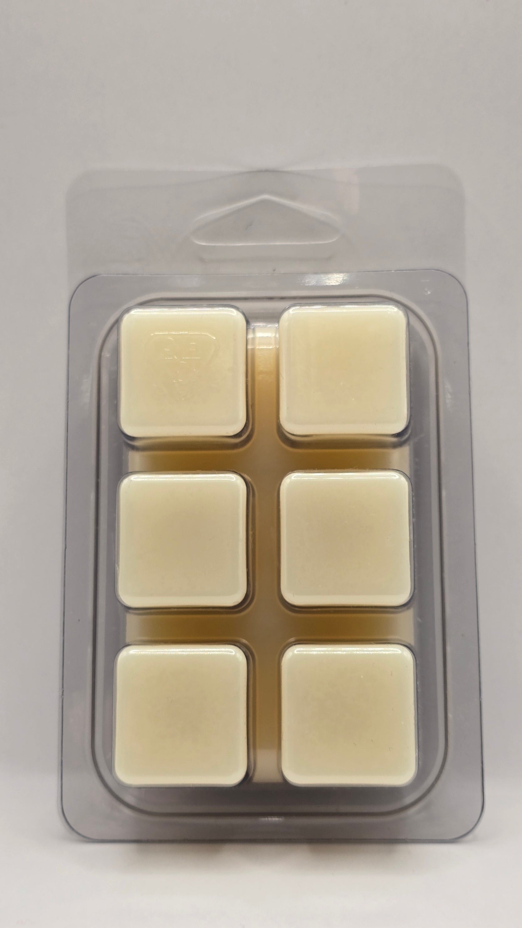 Packaged wax melts on a gray background