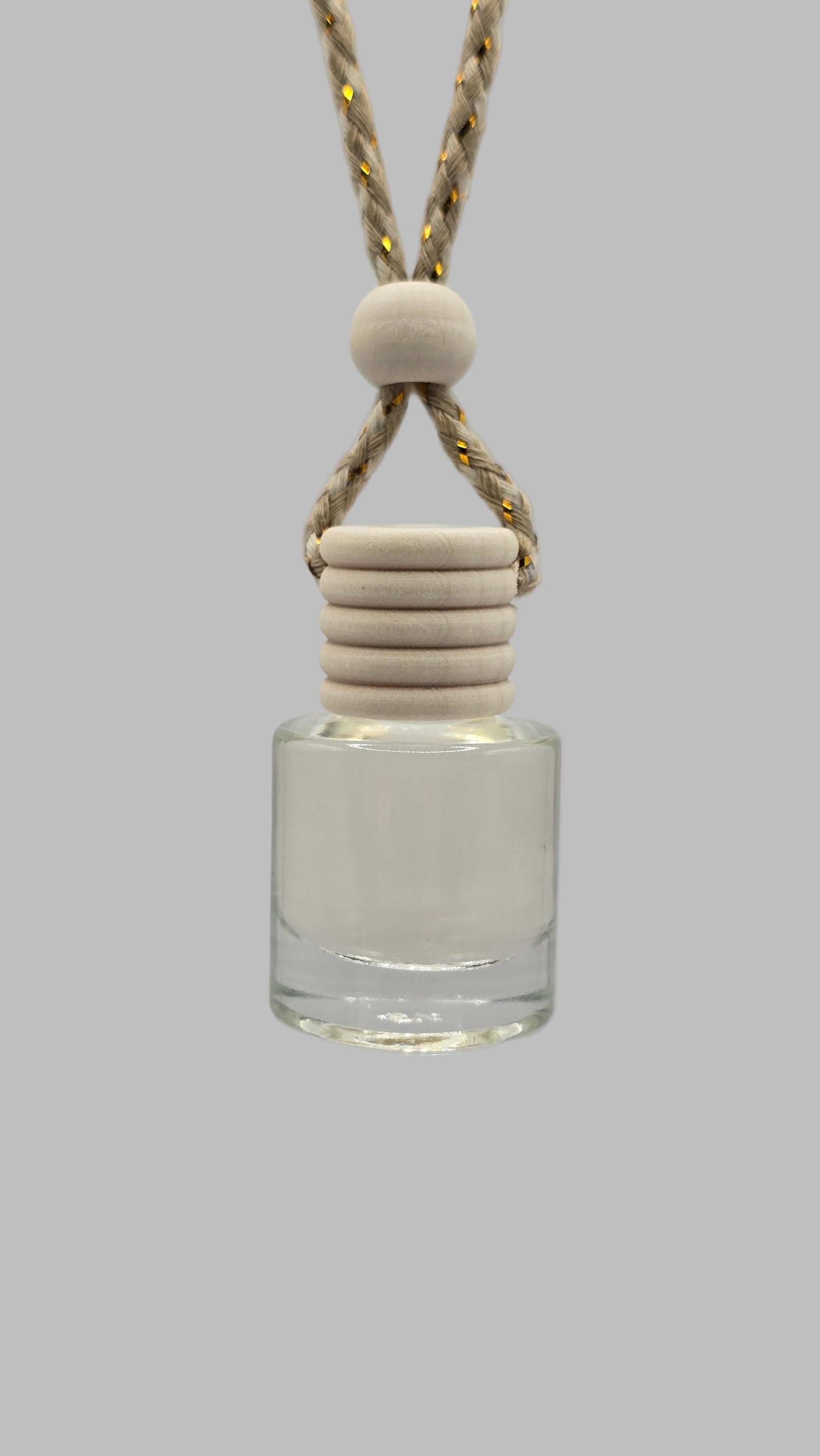 Glass bottle with a white cap and beige cord on a light gray background