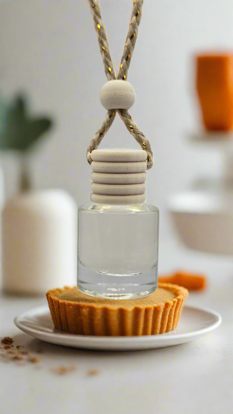 Glass bottle with a white cap and beige cord on a light gray background