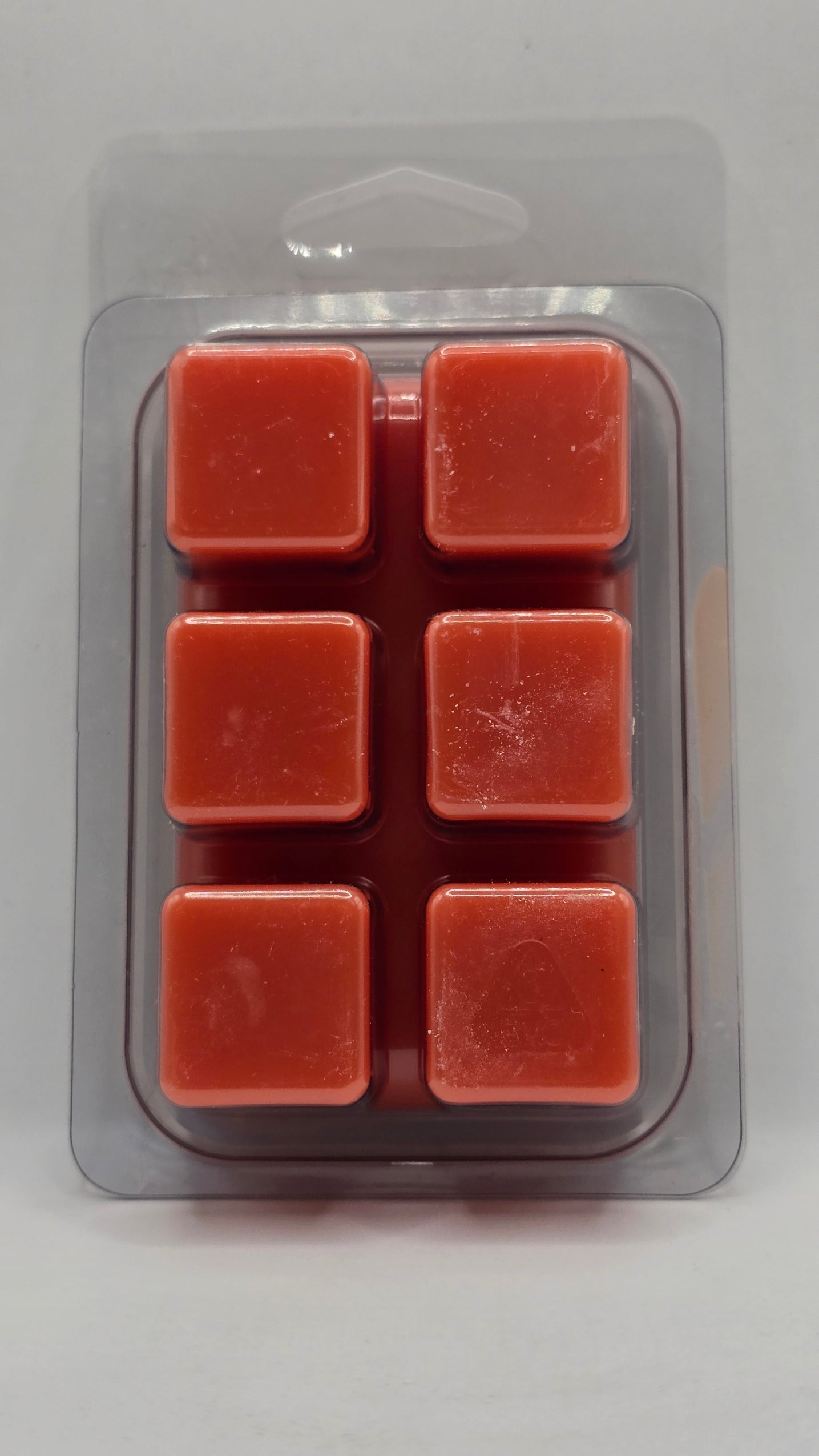 Back of Fruit Slices soy wax melt showing six wax cubes inside clear plastic clamshell packaging.
