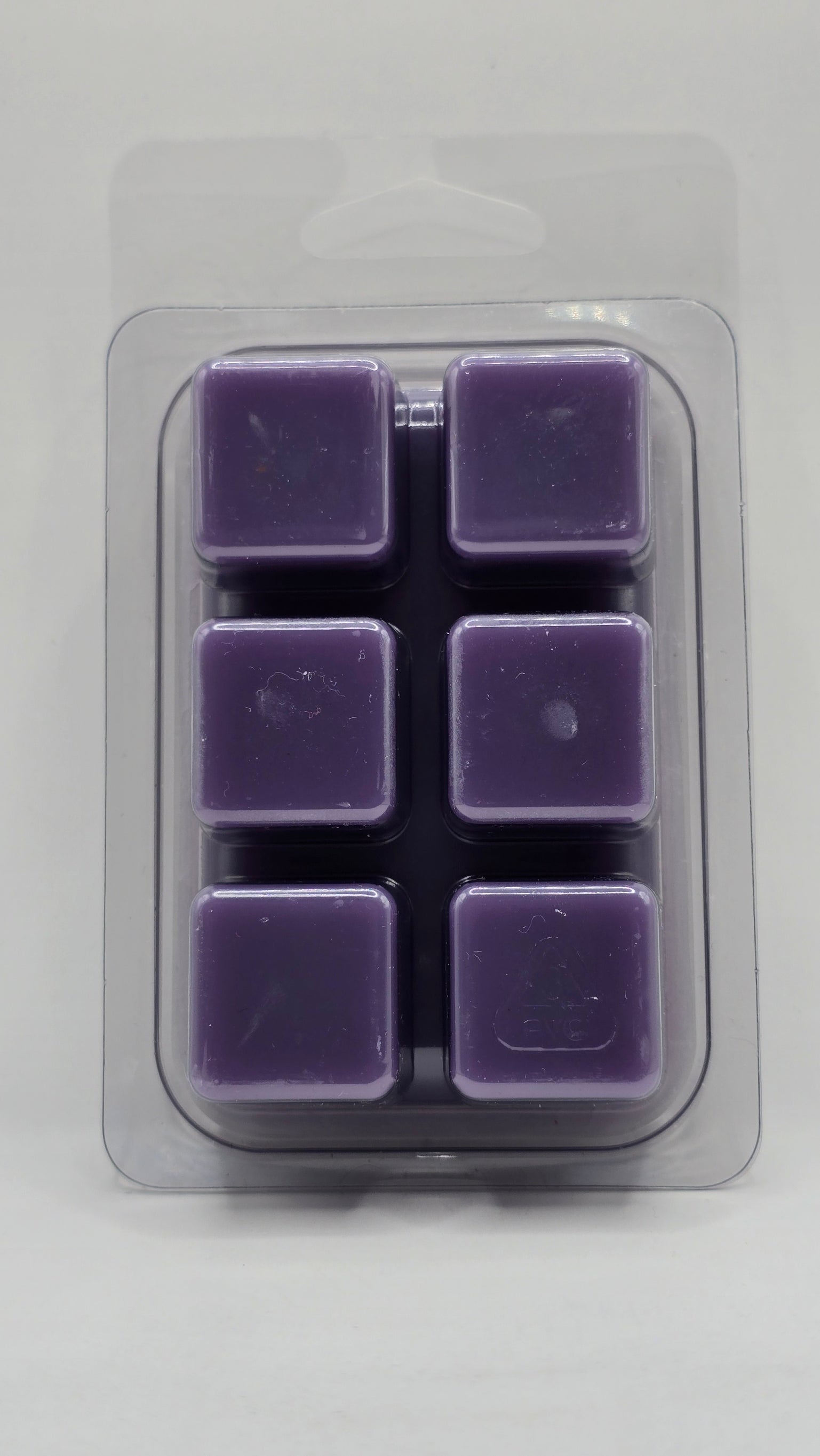 Back of Lemon Lavender soy wax melt showing six wax cubes inside clear plastic clamshell packaging.