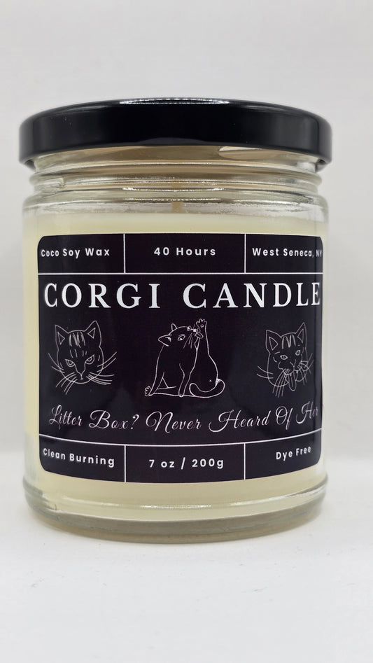 CORGI CANDLE Litter Box? Never Heard Of Her 7 oz soy candle in a clear glass jar with black lid on a white background.