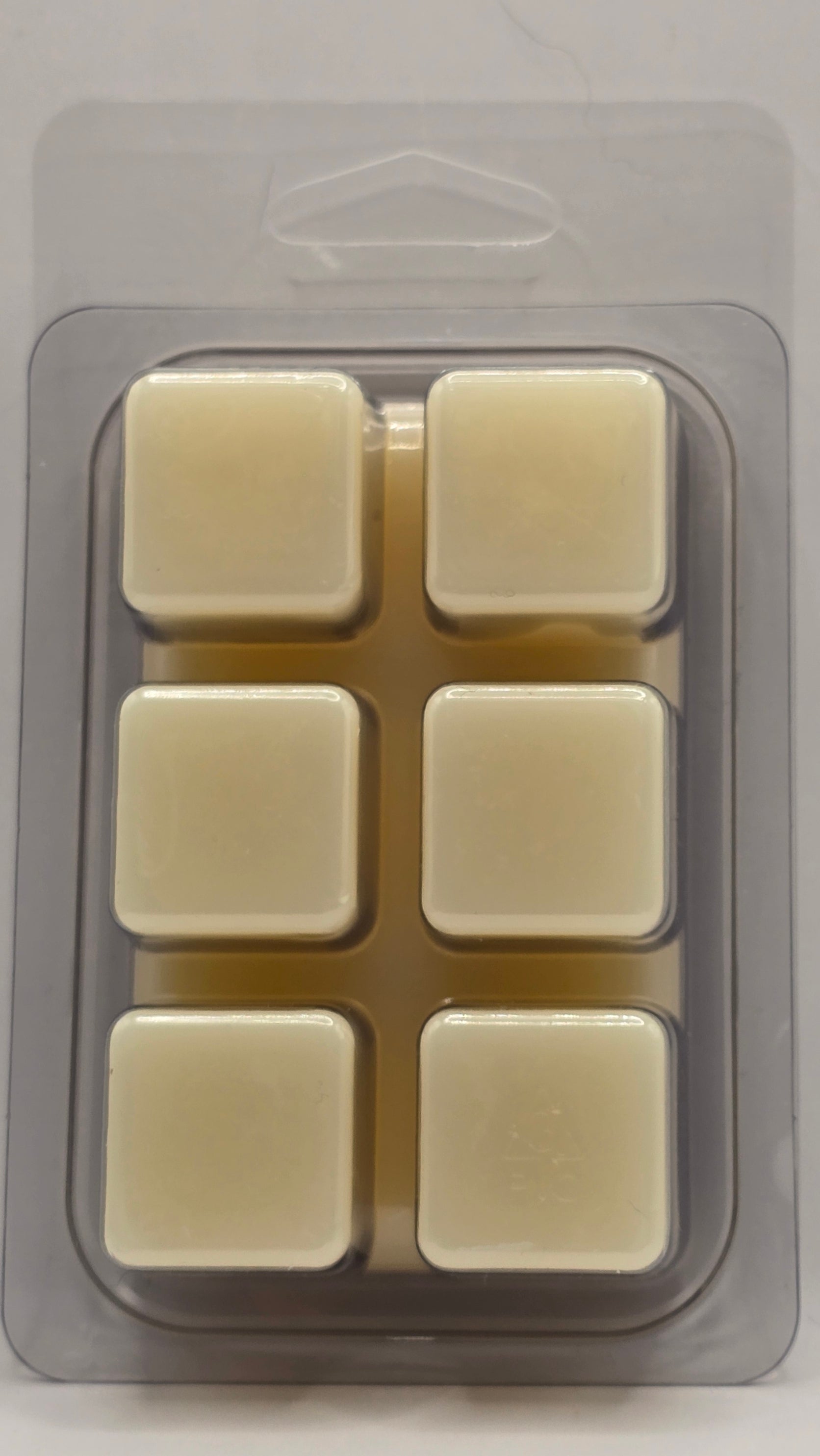 Silicone mold with six square cavities on a gray background