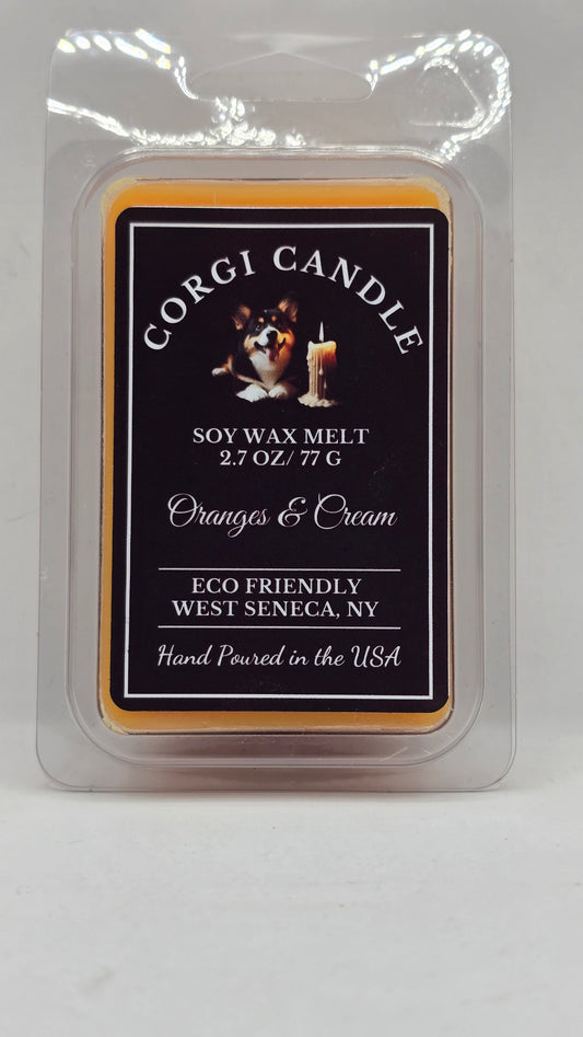Corgi Candle Oranges and Cream soy wax melt in a 2.7 oz clamshell package with a black label, inspired by the nostalgic scent of an orange creamsicle. Hand-poured with a soy wax blend for a clean, long-lasting fragrance that fills your home with sweet citrus and creamy vanilla.
