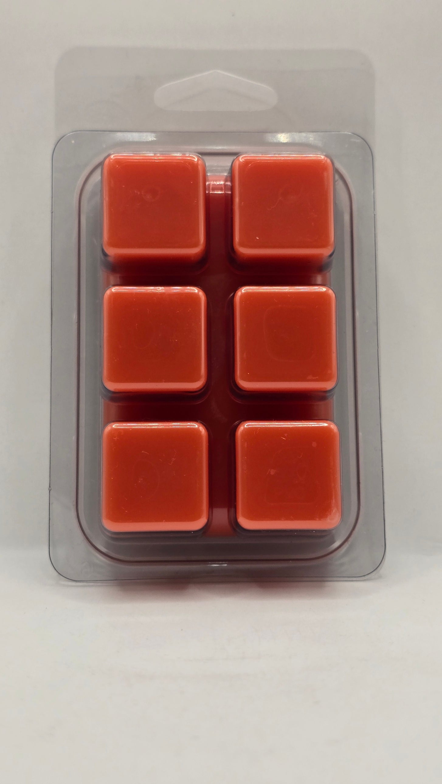 Papaya Passion soy wax melt cubes by CORGI CANDLE in clear clamshell packaging showing six orange wax cubes, 2.7 oz tropical scented wax melt hand poured in West Seneca NY.
