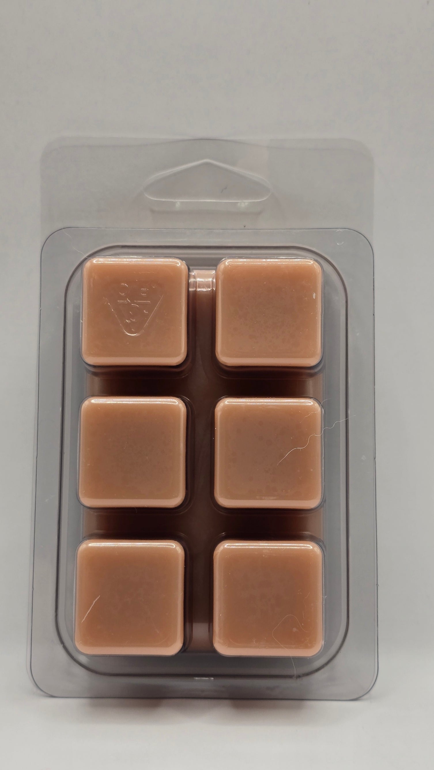 Packaged brown square items on a gray background