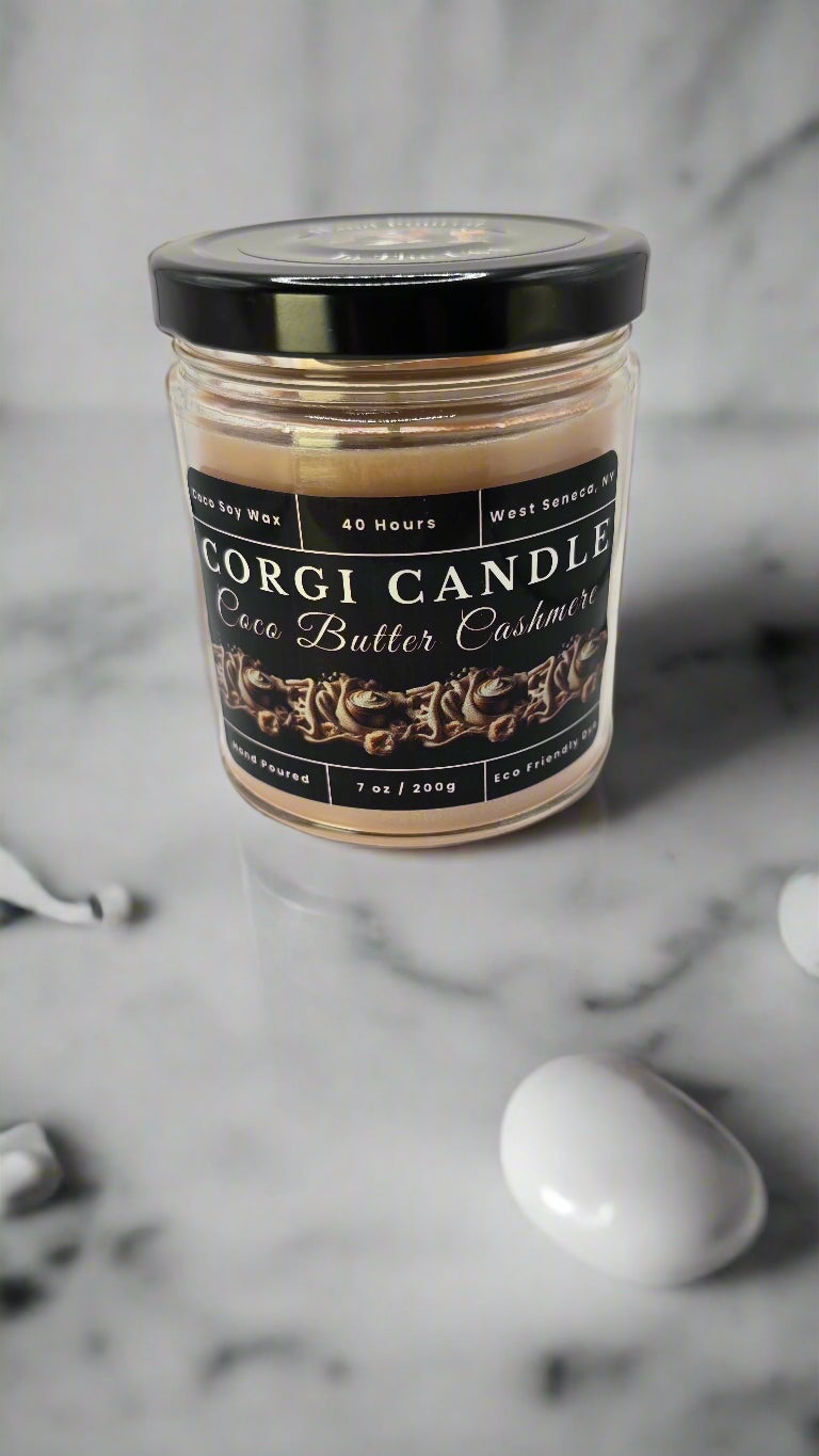 Coco Butter Cashmere candle in a glass jar, hand-poured with soy coconut wax, featuring warm vanilla, coconut, and soft musk notes