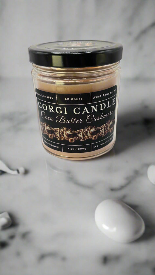 Coco Butter Cashmere candle in a glass jar, hand-poured with soy coconut wax, featuring warm vanilla, coconut, and soft musk notes