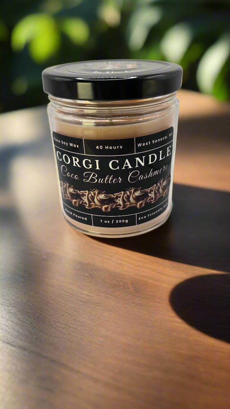 Coco Butter Cashmere candle in a glass jar, hand-poured with soy coconut wax, featuring warm vanilla, coconut, and soft musk notes