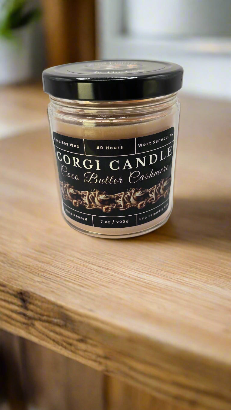 Coco Butter Cashmere candle in a glass jar, hand-poured with soy coconut wax, featuring warm vanilla, coconut, and soft musk notes