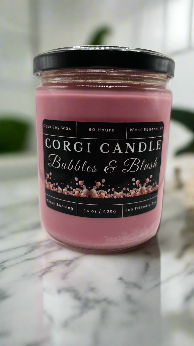 Bubbles & Blush 14 oz soy candle in a clear glass jar with a soft pink label, hand-poured by CORGI CANDLE