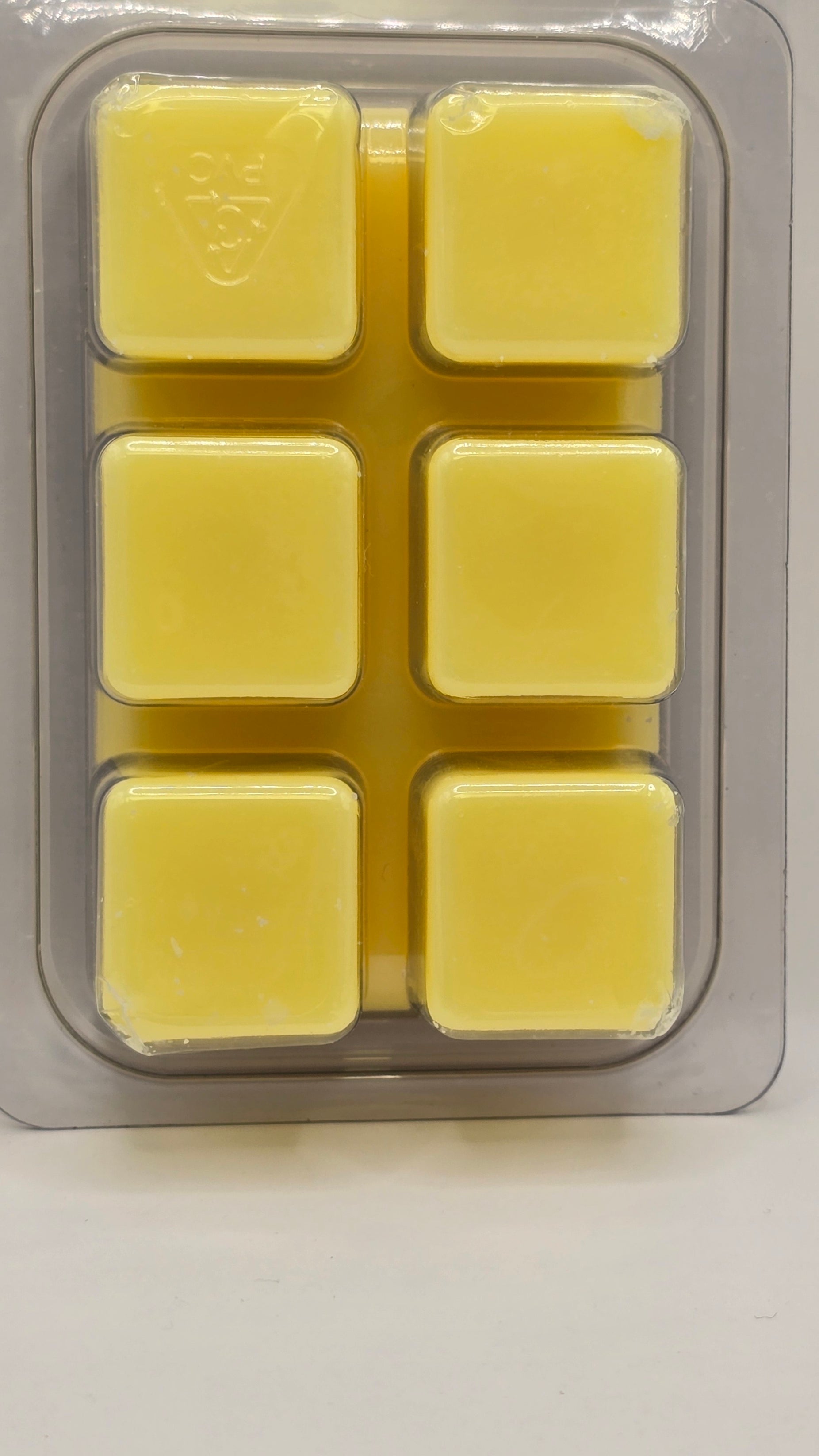 Back of CORGI CANDLE Honeysuckle Haven Wax Melts displaying product details and usage instructions in clamshell packaging