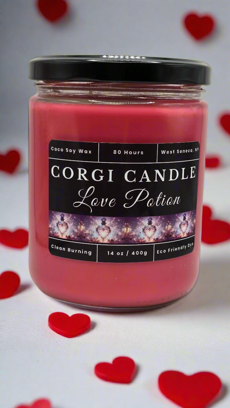 Love Potion soy candle in a romantic-toned glass jar with floral accents, featuring a peach, cherry blossom, and jasmine fragrance by CORGI CANDLE.