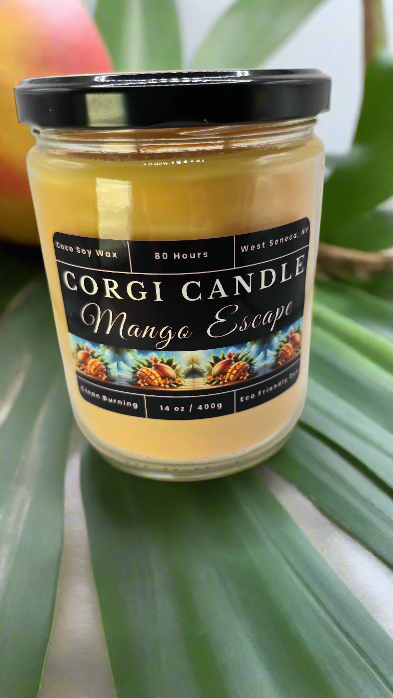 Corgi Candle Mango Escape 14 oz soy candle in a clear glass jar with a clean tropical label, featuring fruity notes of mango, coconut, and pineapple