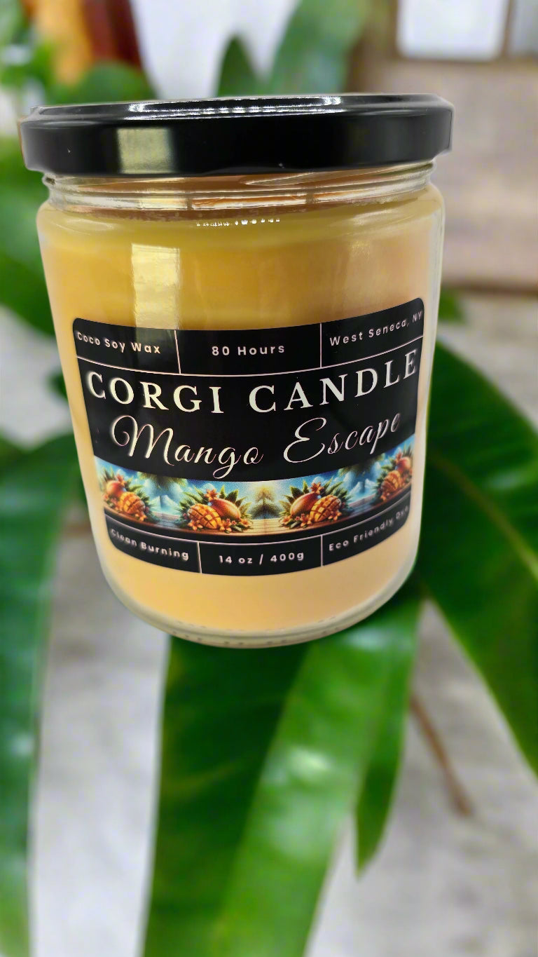 Corgi Candle Mango Escape 14 oz soy candle in a clear glass jar with a clean tropical label, featuring fruity notes of mango, coconut, and pineapple