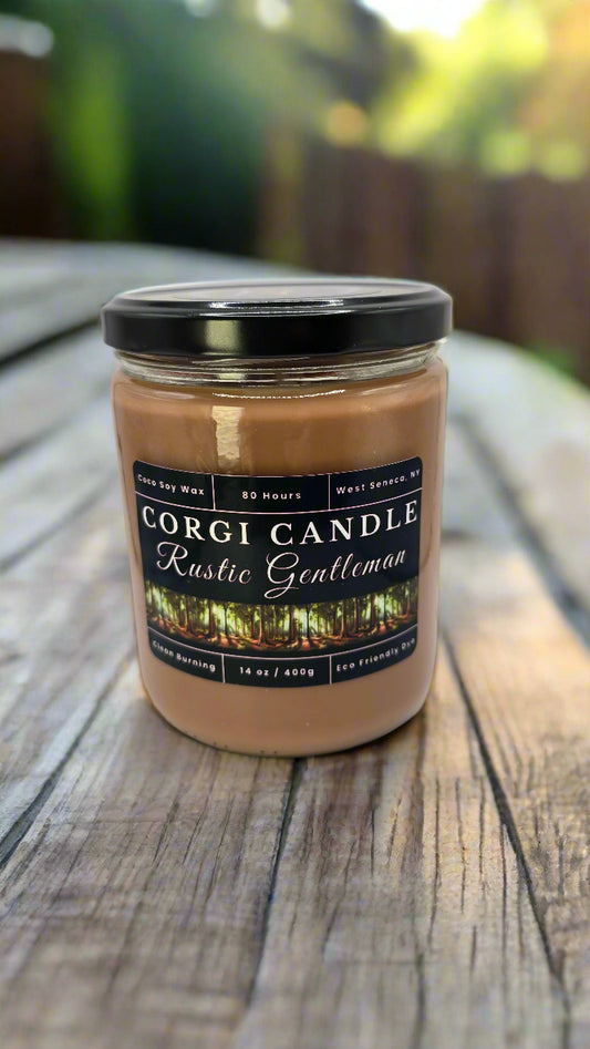 Rustic Gentleman 14 oz soy candle by CORGI CANDLE in a sleek glass jar with a masculine label, featuring teakwood, oak, and cedar notes.