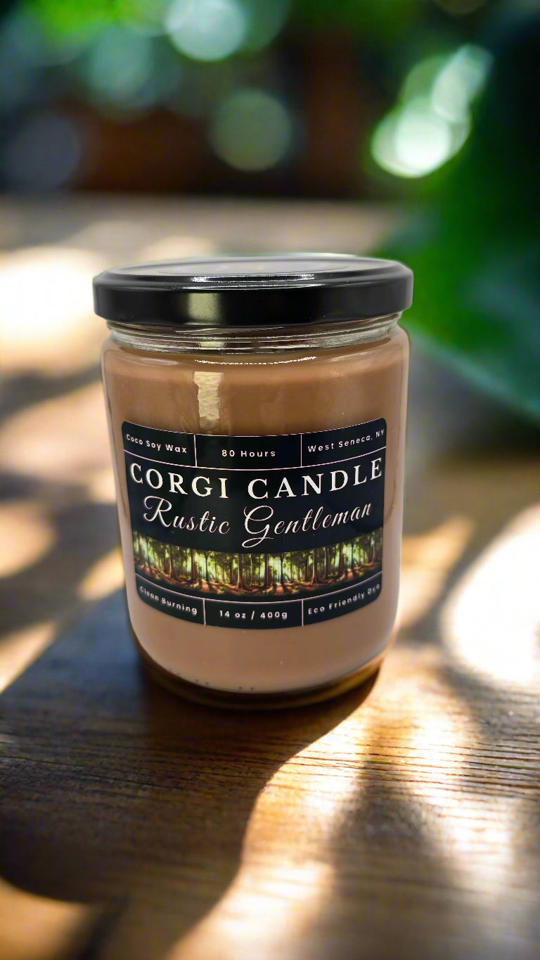 Rustic Gentleman 14 oz soy candle by CORGI CANDLE in a sleek glass jar with a masculine label, featuring teakwood, oak, and cedar notes