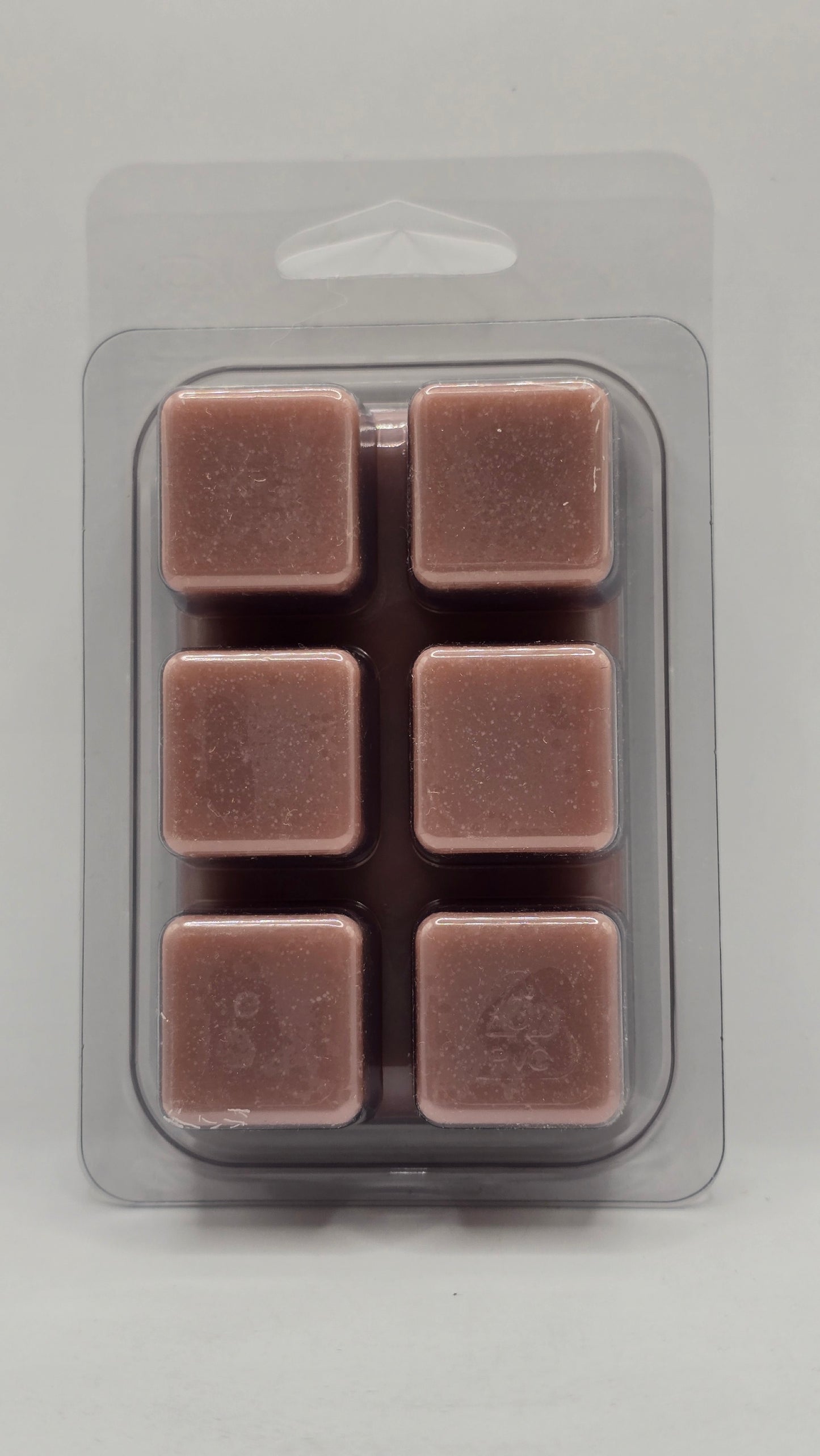 Back of Lilac soy wax melt showing six wax cubes inside clear plastic clamshell packaging.