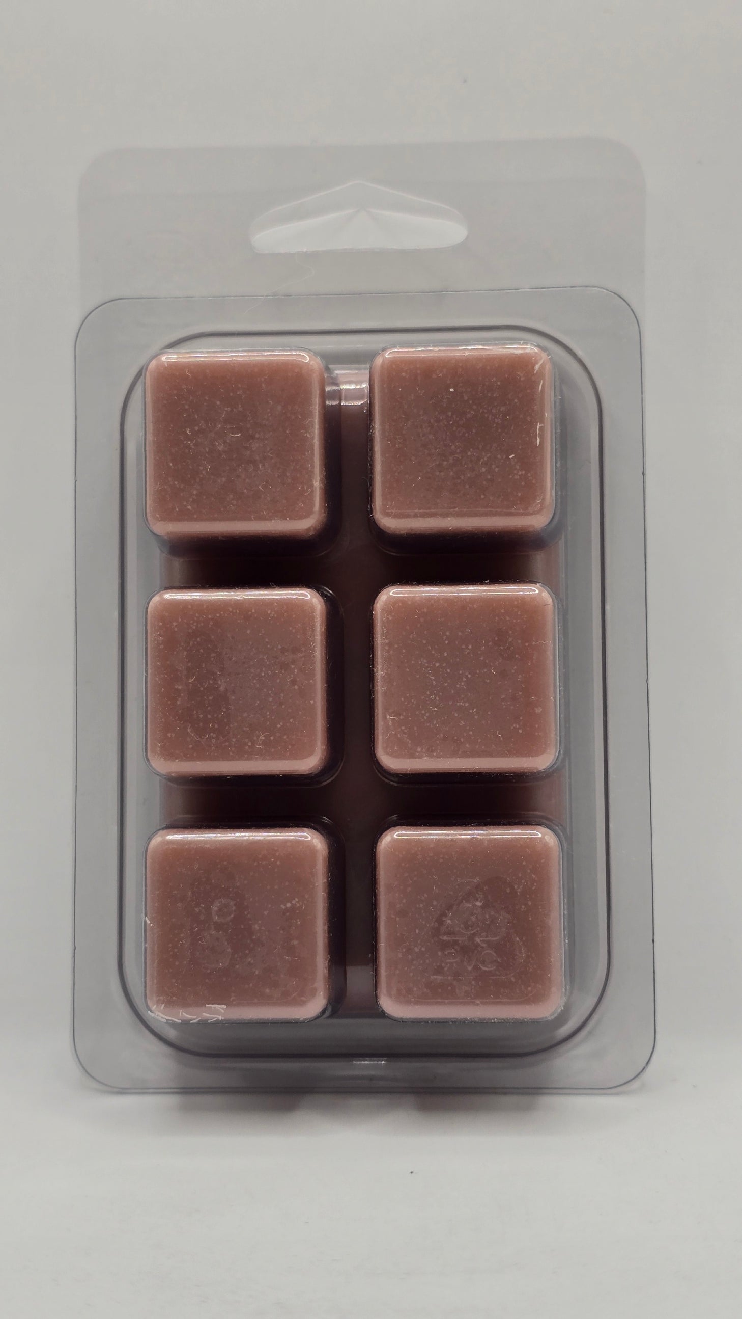 Back of Lilac soy wax melt showing six wax cubes inside clear plastic clamshell packaging.