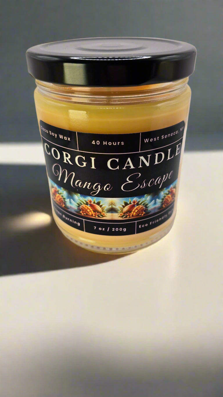 Mango Escape candle in a glass jar, hand-poured with soy coconut wax, featuring notes of mango, pineapple, coconut, and vanilla