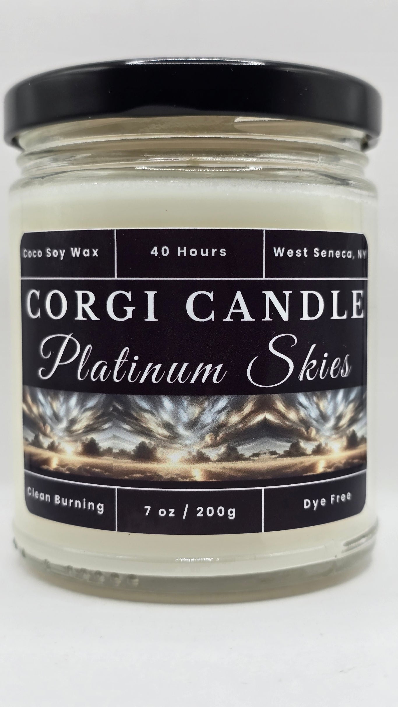 Platinum Skies 7 oz soy scented candle by CORGI CANDLE in glass jar with black lid featuring storm sky label, clean burning coco soy candle hand poured in West Seneca NY.
