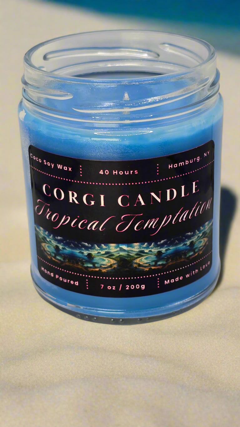 Tropical Temptation 7 oz soy candle in a glass jar with a beach-inspired label, hand-poured by CORGI CANDLE and scented with a Brazilian Crush blend of pistachio, salted caramel, vanilla, and sandalwood.