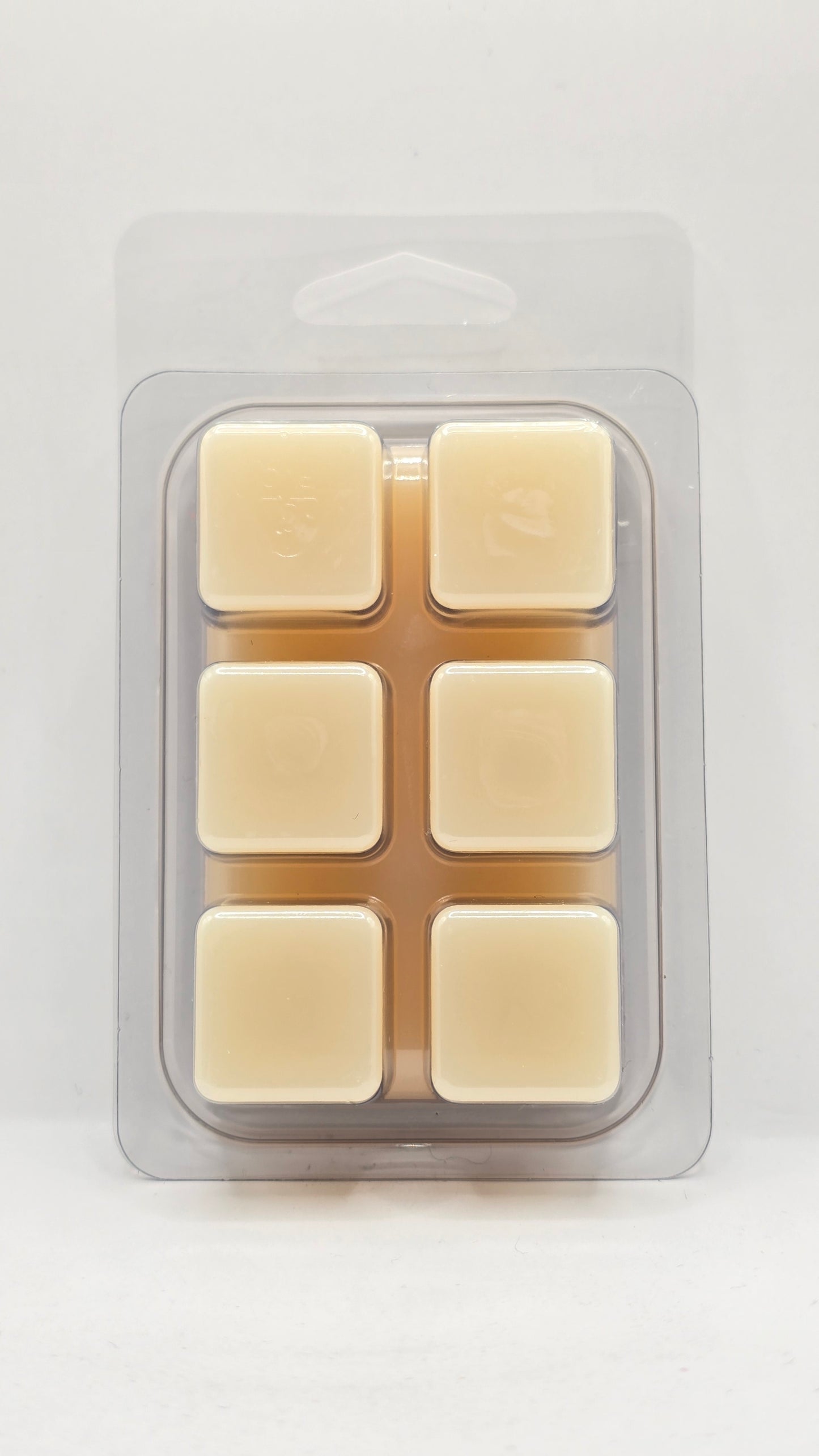 back of Platinum Skies soy wax melt clamshell by CORGI CANDLE showing six cube wax melts in clear packaging with smooth cream colored wax
