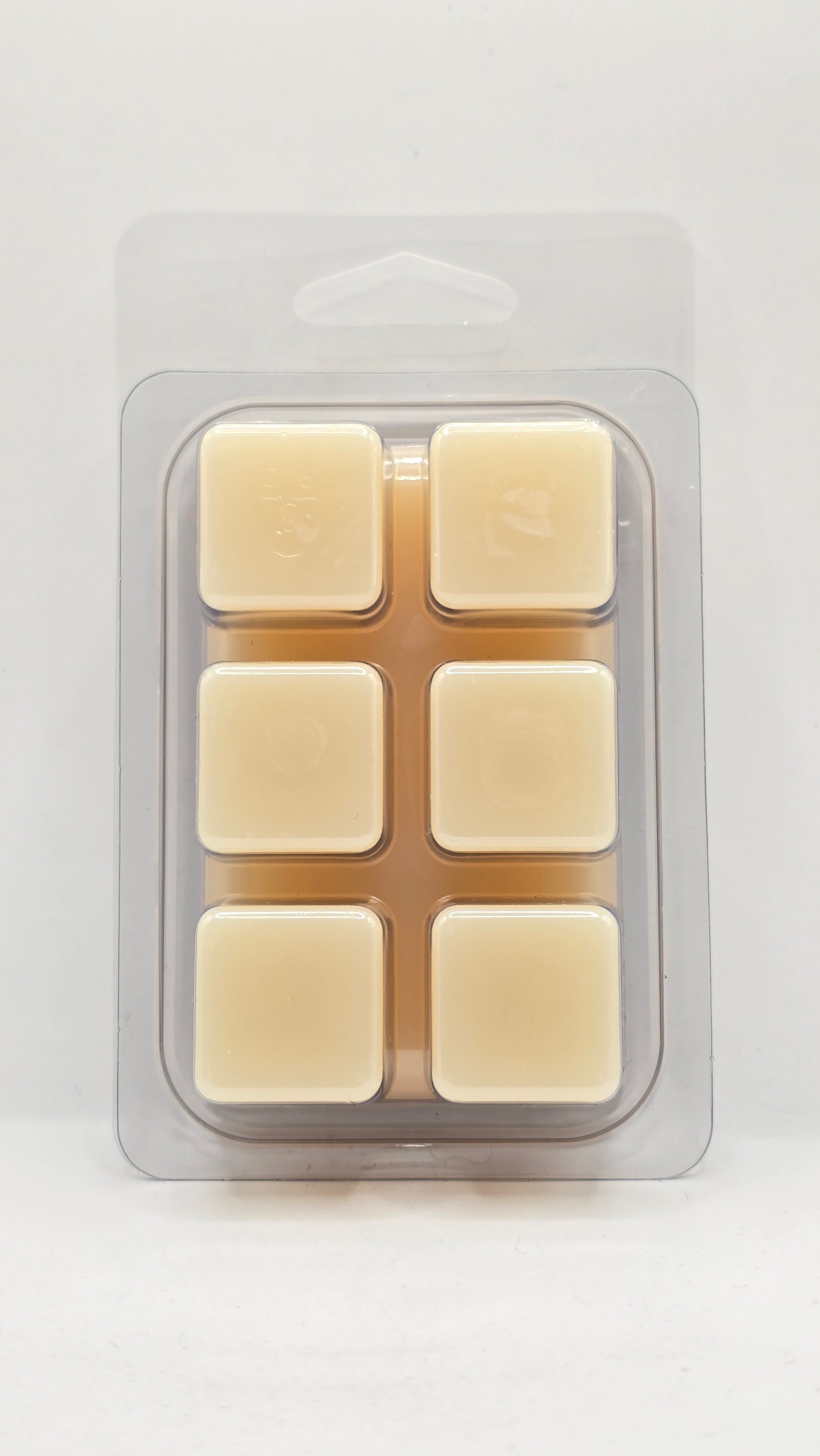 back of Platinum Skies soy wax melt clamshell by CORGI CANDLE showing six cube wax melts in clear packaging with smooth cream colored wax